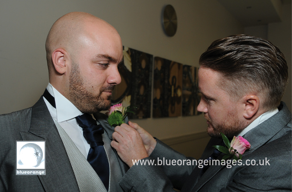 Best man sorting out groom’s buttonhole, Denham Grove Hotel 