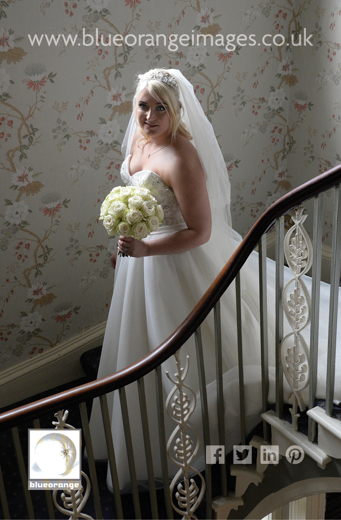 Bride on stairs St Michael’s Manor Hotel, St Albans