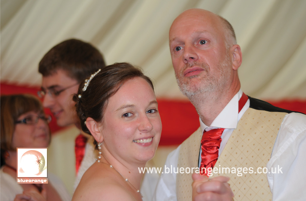 The bride and the father of the bride dancing at wedding reception