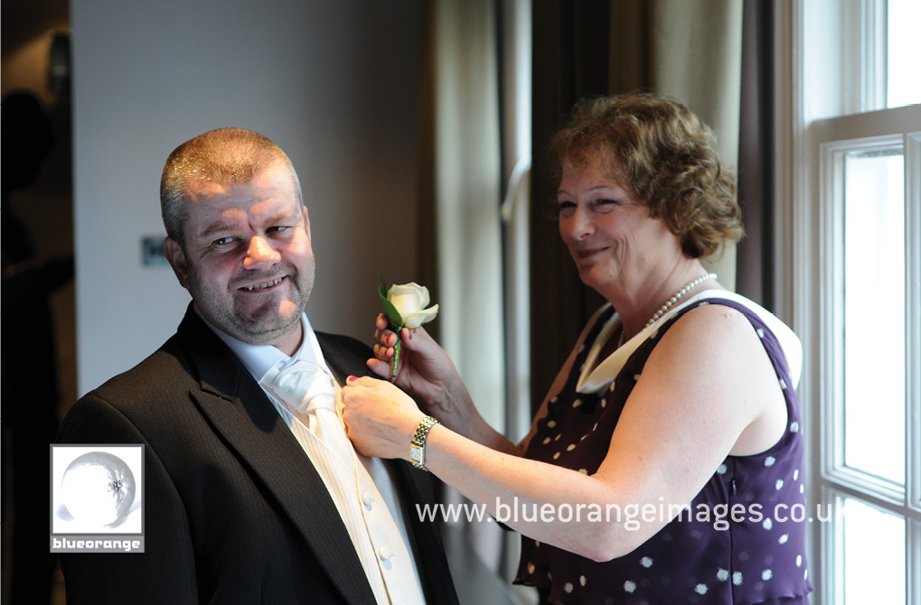 The groom and the proud mother of the bride