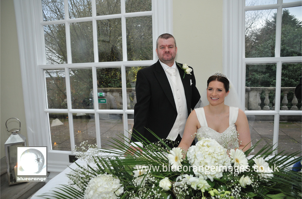 Bride & groom, Chrissie & Jon, at the ceremony in The Orangery. Hunton Park, Watford