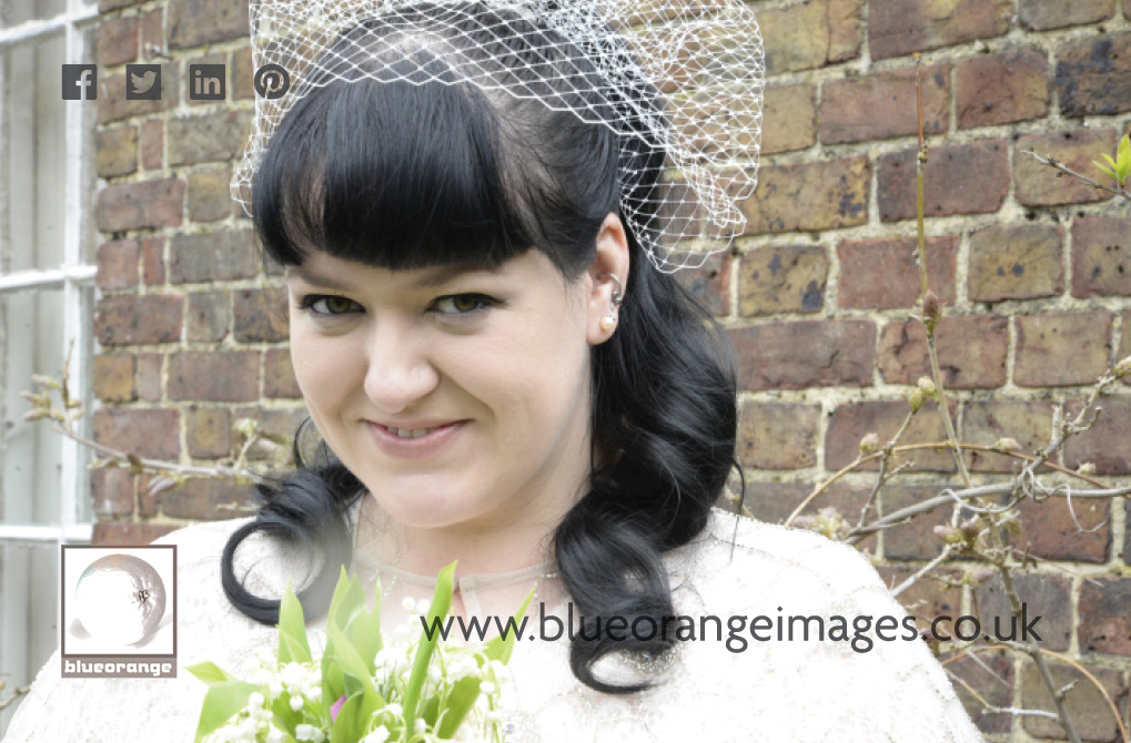 Carrie the bride, in the Watford register office garden, after the wedding