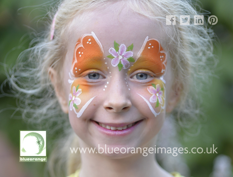 Blue Orange Images face painting, Watford, orangey butterfly theme with pink flowers